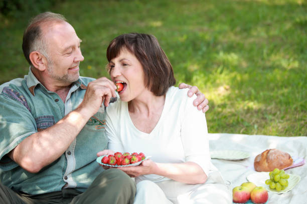 istock Senior couple on picnic having fun 1182971454