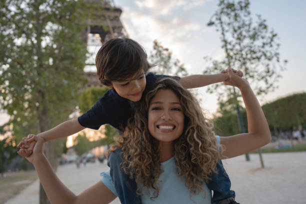 istock Happy mother and son playing outdoors in Paris 1182973501