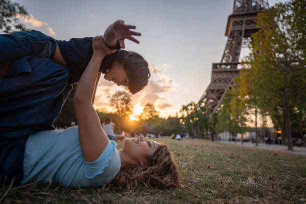 istock Happy mother and son playing outdoors in Paris 1182973528