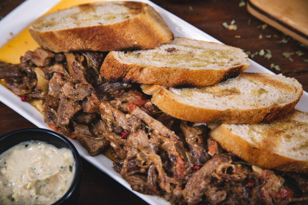 istock shredded beef on wood 1182974610