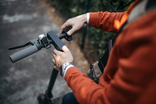 istock Man riding electric push scooter 1182979691