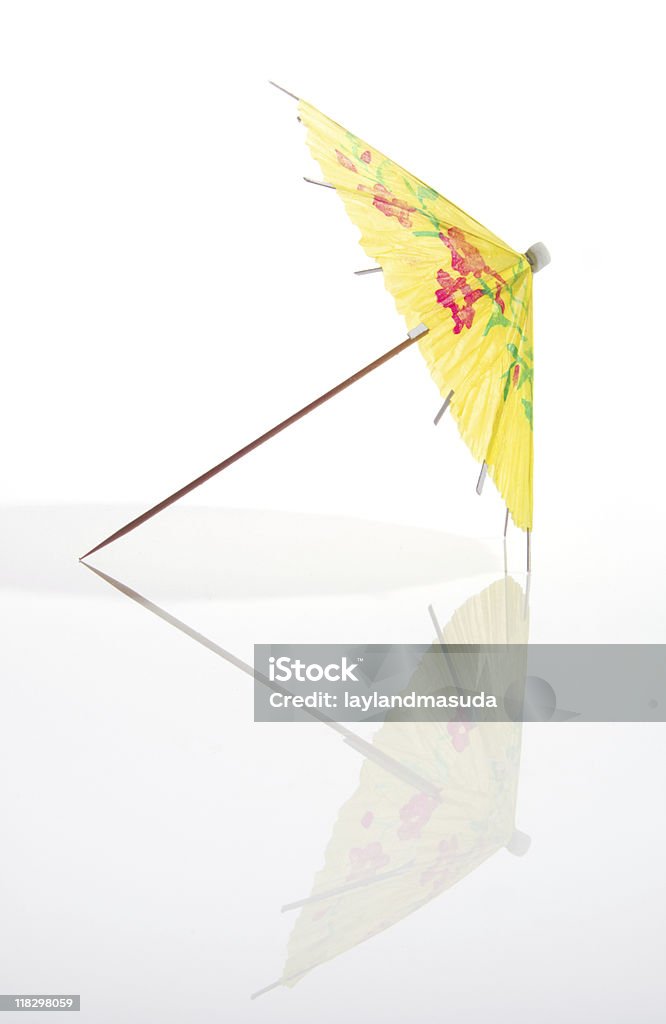 Yellow Cocktail Umbrella With Full Reflection  Drink Umbrella Stock Photo