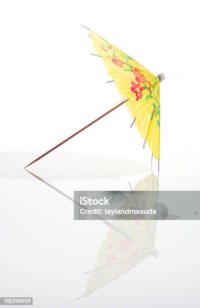 Yellow Cocktail Umbrella With Full Reflection Stock Photo - Download Image Now - Drink Umbrella, Cocktail, Umbrella