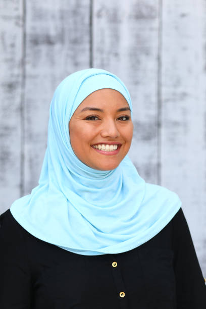istock Middle Eastern Woman Blue Hijab Smile Vertical 1182981092