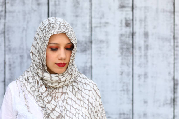 istock Middle Eastern Woman Wearing Hijab No Smile Left 1182981121