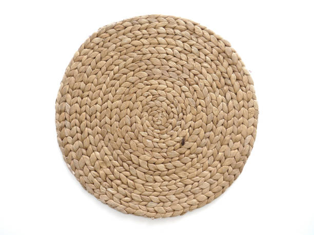 istock Top view texture of handmade round beige wicker tablecloth surface isolated on white background 1182983961