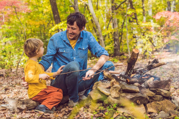 istock Happy father doing barbecue with his son on an autumn day 1182984267