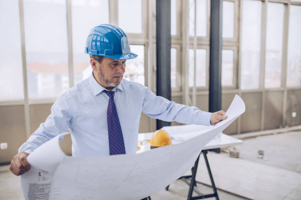 istock Businessman controls the construction of office space 1182985462