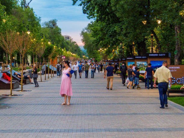 Panfilov street, Almaty, Kazakhstan Almaty, Kazakhstan - June 20, 2018: People walking on Panfilov street at sunset. almaty photos stock pictures, royalty-free photos & images