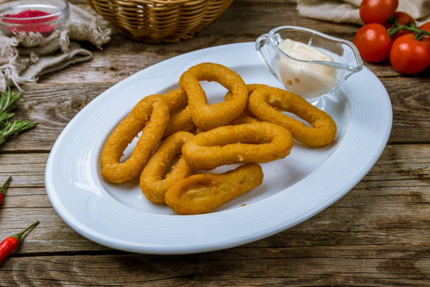 istock Rings of squid in batter with sauce 1182986434