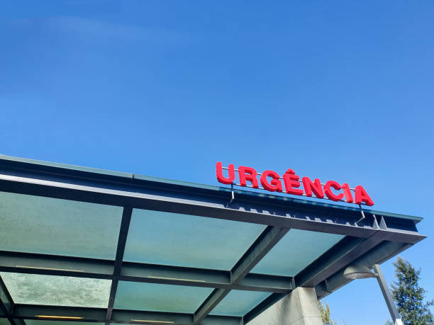 istock Emergency sign in red tone with blue sky in background. 1182986585