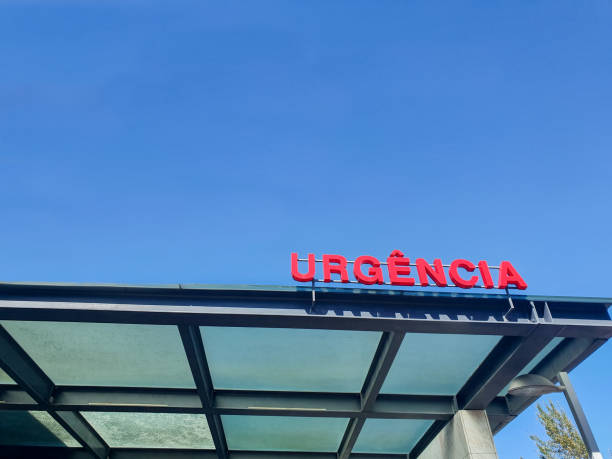 istock Emergency sign in red tone with blue sky in background. 1182986589
