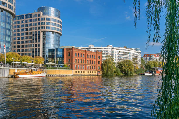 River Spree, newly designed area Spree-Bogen with buildings of the business center and hotel Villa Abion in Berlin, Germany Berlin, Germany - October 14, 2019: River Spree and the newly designed area Spree-Bogen with the buildings of the business center, former Bundesministerium, and of the Ernst-Freiberger foundation, now boutique hotel Villa Abion moabit stock pictures, royalty-free photos & images