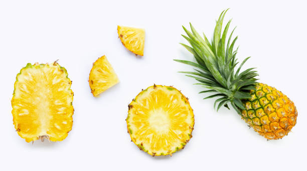 istock Fresh whole and cut pineapple isolated on white 1182987744