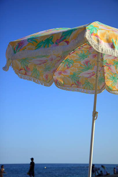 istock Colorful parasol against bright blue sky 118299051