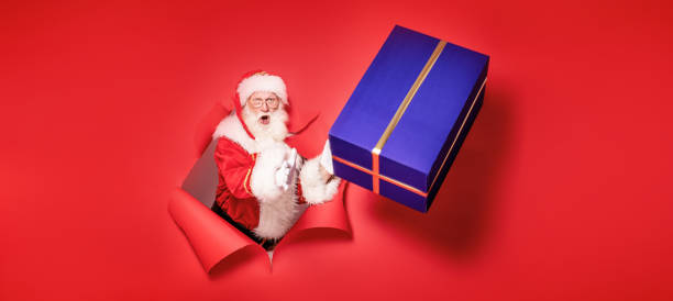istock Santa Claus with the big gift box. 1182991792