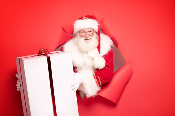 istock Santa Claus with the big gift box. 1182992499
