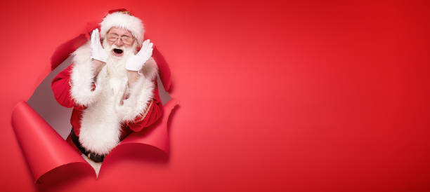 istock Emotional Santa Claus on the red background. 1182992509