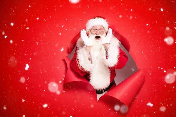 istock Emotional Santa Claus on the red background. 1182992525