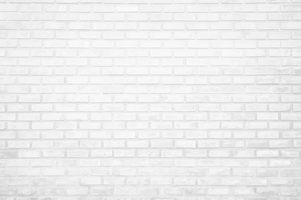 istock Wall white brick wall texture background in room at subway. Brickwork stonework interior, rock old clean concrete grid uneven abstract weathered bricks tile design, horizontal architecture wallpaper. 1182994740