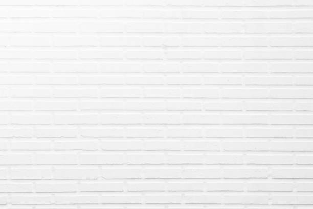 istock Wall white brick wall texture background in room at subway. Brickwork stonework interior, rock old clean concrete grid uneven abstract weathered bricks tile design, horizontal architecture wallpaper. 1182994743