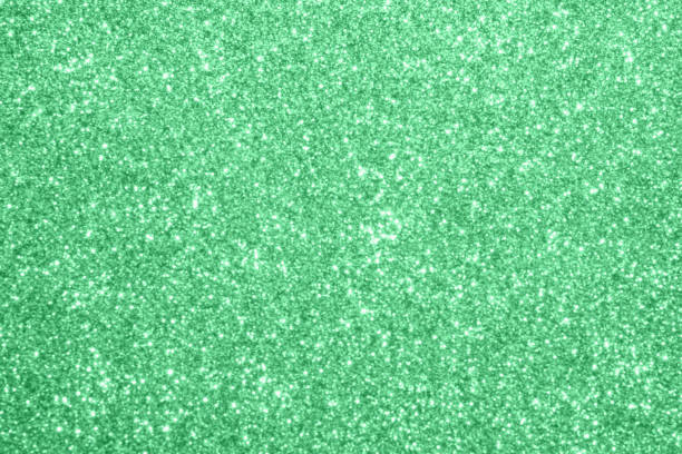 istock Abstract blur green glitter sparkle defocused bokeh light background 1182995177