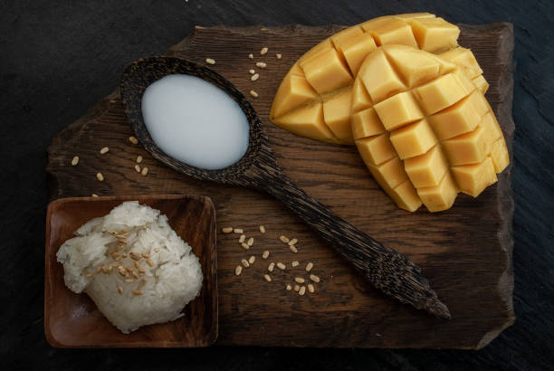 istock Fresh ripe mango (Barracuda mango) and sticky rice with coconut milk, authentic Thai dessert, Thailand's very popular dessert. 1182995950