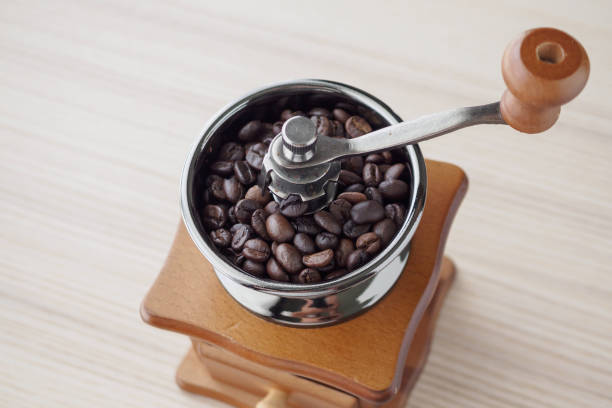 istock Vintage manual coffee grinder with roasted coffee beans 1182996116
