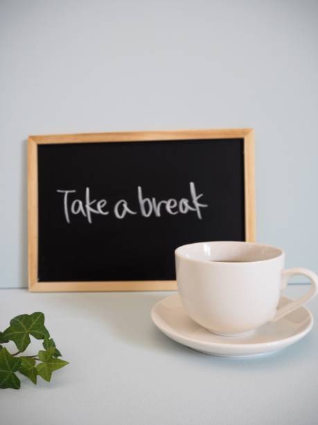 istock White cup and saucer with coffee and black board with 