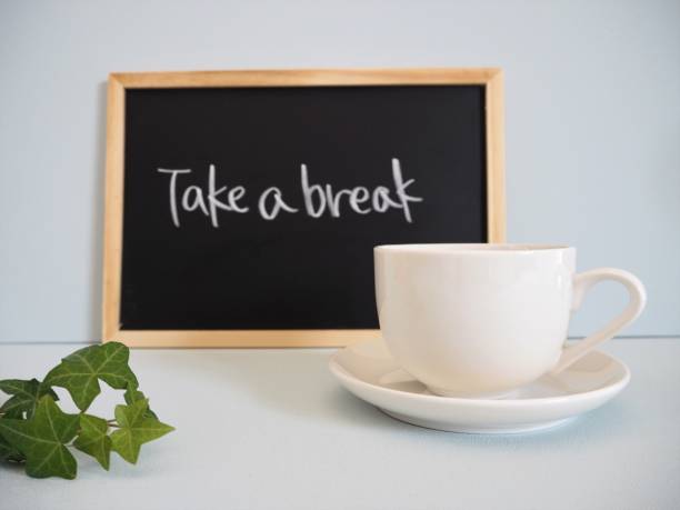 istock White cup and saucer with coffee and black board with 