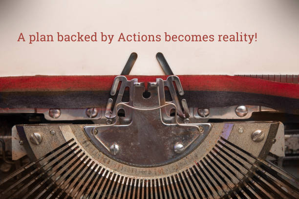 istock Old manual typewriter typed text a plan backed by actions becomes reality 1182999596