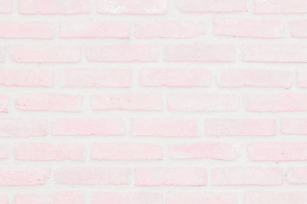 istock Abstract Pastel Pink and White brick wall texture background pre wedding. Brickwork or stonework lovely flooring interior rock old pattern clean concrete grid uneven bricks. 1183001847