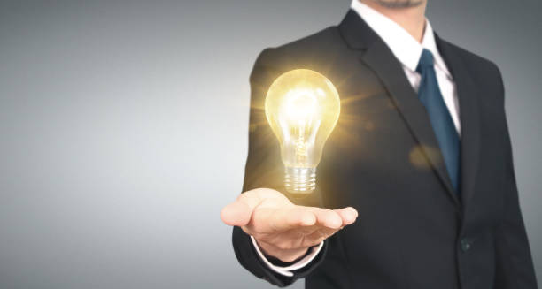 istock Hand of holding illuminated light bulb, innovation inspiration concept 1183004241