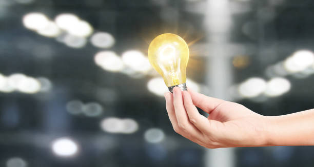 istock Hand of holding illuminated light bulb, innovation inspiration concept 1183004261