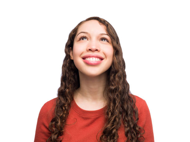 istock Young woman looking up 1183004482