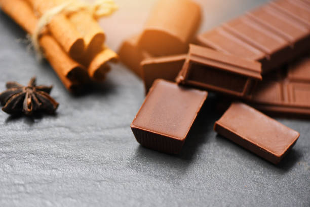 istock Chocolate bar and spice on dark background sweet dessert for snack 1183007751