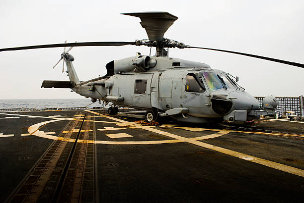 istock Helicopter onboard warship at sea 118300874