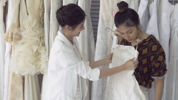 istock Future bride customer talking with wedding store shopkeeper 1183011764