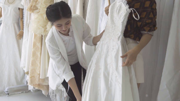 istock Future bride customer talking with wedding store shopkeeper 1183011781