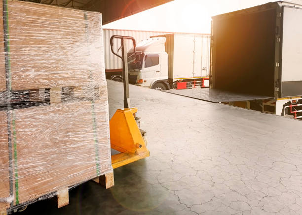 istock The truck container docking load shipment at warehouse 1183011824