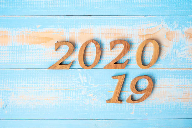 istock change 2019 to 2020 number on wood background. Resolution, strategy, solution, goal, Mission, business, New Year New You and happy holiday concepts 1183021512