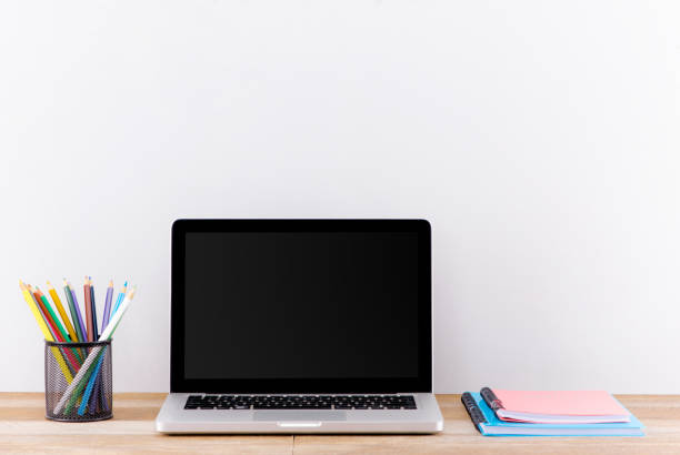 istock Mock up laptop, notebook on young student desk. Cyan pastel colors. 1183024384