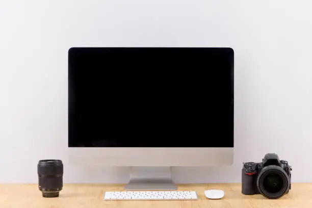 Photo of Photographer workspace mockup with desktop computer screen isolated.