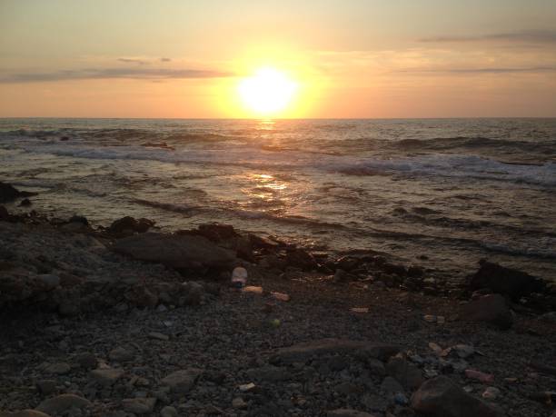 istock Pretty Sunsets On A Polluted Beach 1183024943