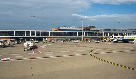 Charleroi, Belgium. The Charleroi Bruxelles Sud international airport. View if the gates and parking of the airplanes
