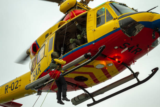 at sea - english channel - oct 1st 2012: coast guard search and rescue helicopter sar training - rescue helicopter water searching imagens e fotografias de stock