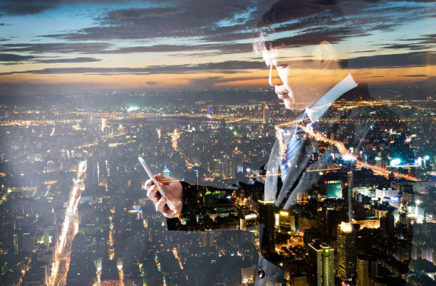 istock Multiple exposure of businessman using smart phone 1183037209