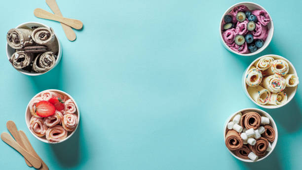 istock rolled ice creams in cone cups on blue background 1183037223