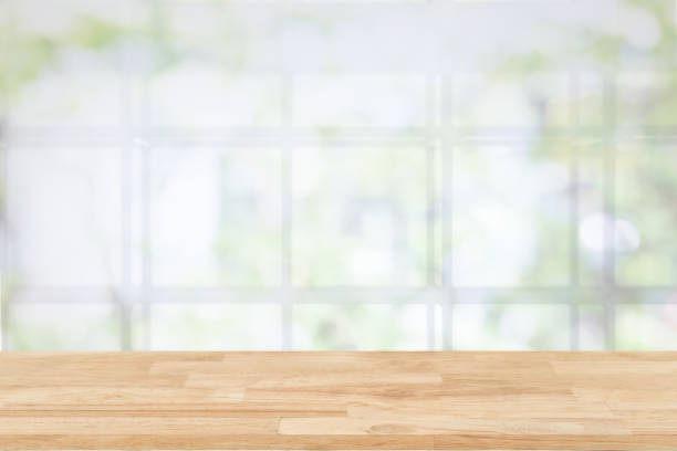 Empty wooden table and window room interior decoration background, product montage display,can be used for display or montage your products.Mock up for display of product. stock photo