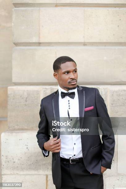 Afro American Successful Man Wearing Dark Suit And Standing Near Wall Outdoors Stock Photo - Download Image Now - iStock Afro American Successful Man Wearing Dark Suit And Standing Near Wall Outdoors Stock Photo - Download Image Now - Istock